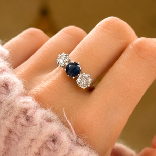 antique 1930s sapphire and diamond ring in 18ct white gold for sale in Leeds, shown on a hand