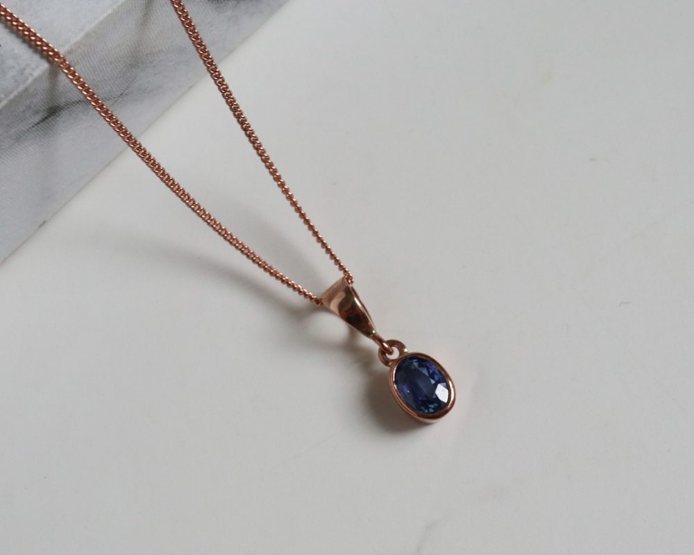 Modern 9ct rose gold and sapphire pendant necklace for sale