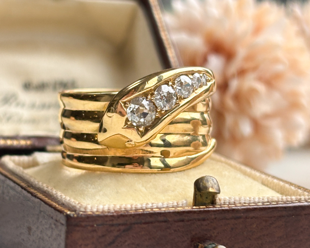 antique diamond snake ring in 18ct yellow gold, with hallmarks for 1918 and 0.5ct old cut diamonds for sale in Leeds, shown in a brown old box