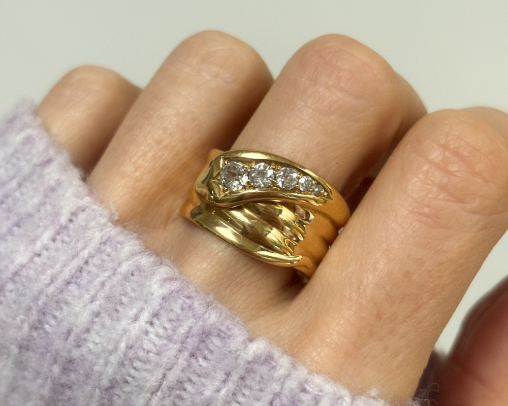 antique diamond snake ring in 18ct yellow gold, with hallmarks for 1918 and 0.5ct old cut diamonds for sale in Leeds, shown on a woman's finger