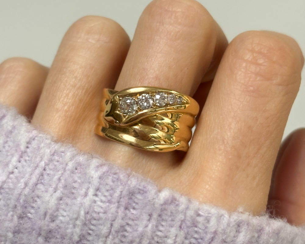 antique diamond snake ring in 18ct yellow gold, with hallmarks for 1918 and 0.5ct old cut diamonds for sale in Leeds, shown on a woman's finger