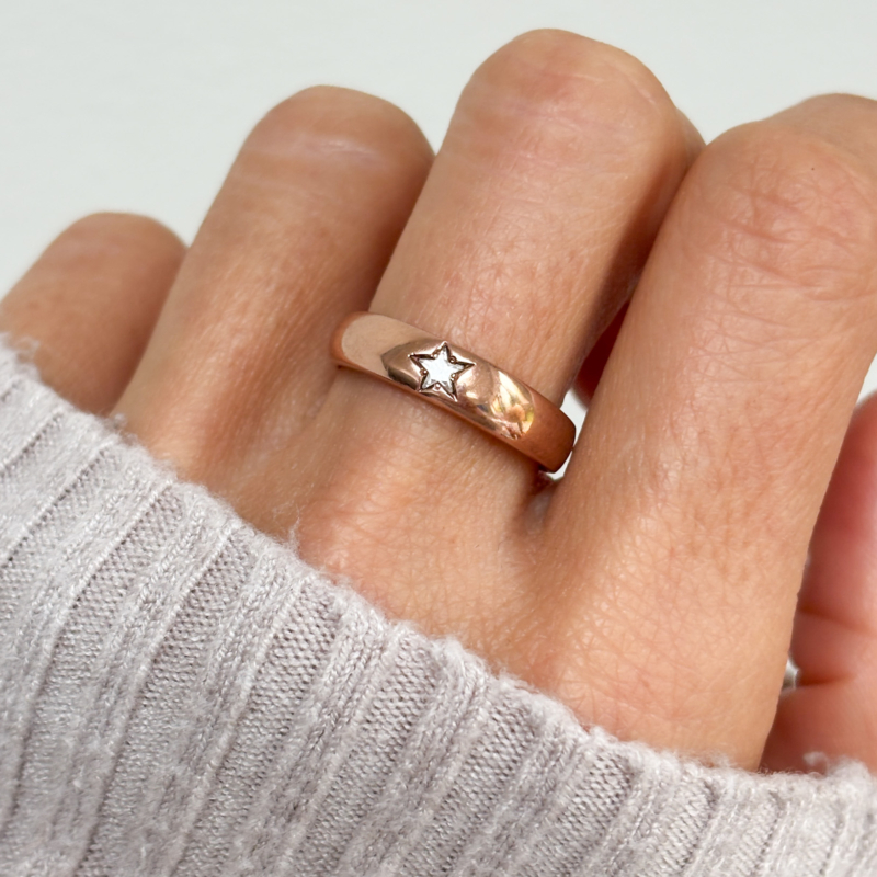 9ct rose gold star diamond ring for sale in Leeds, UK, shown on woman's finger