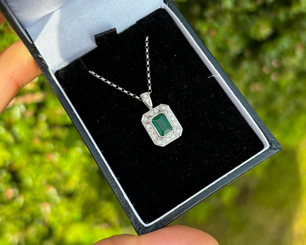 Art deco style emerald and diamond pendant necklace set in 9ct white gold for sale in Leeds, Yorkshire