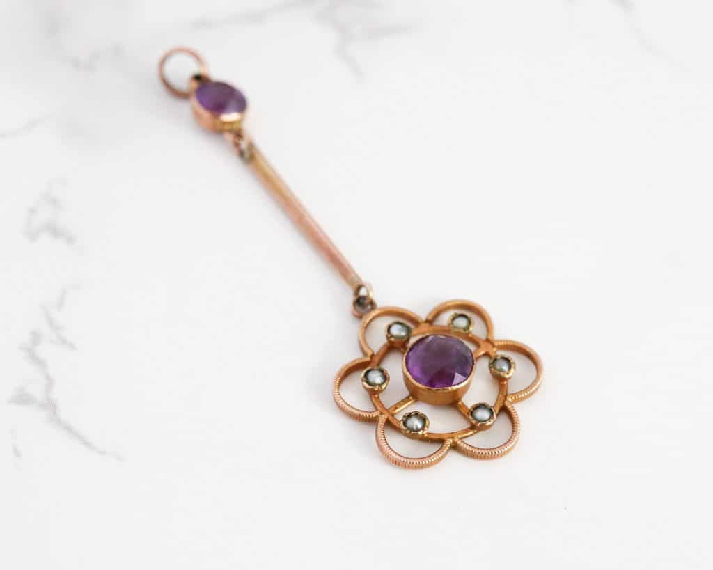 antique amethyst and seed pearl pendant on mannequin neck