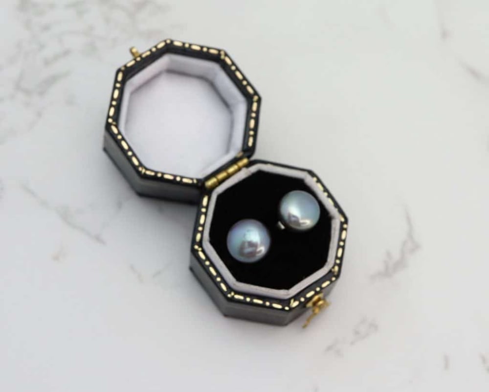 silver and black pearl studs in box