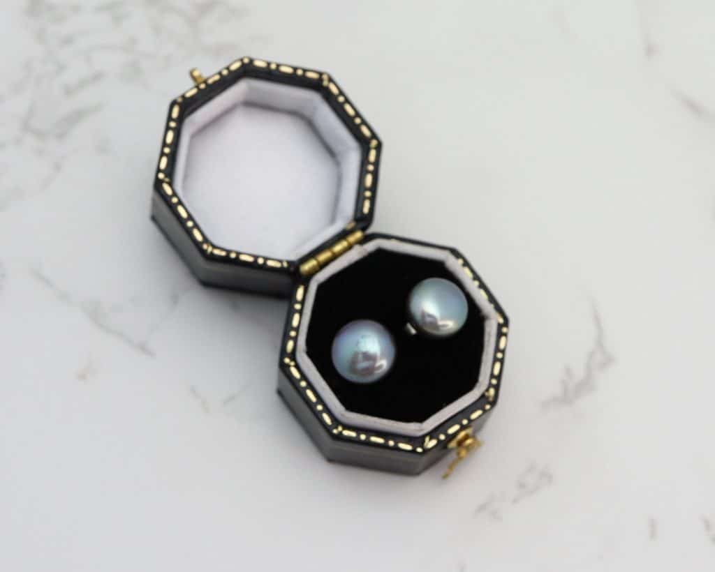 silver and black pearl studs in box