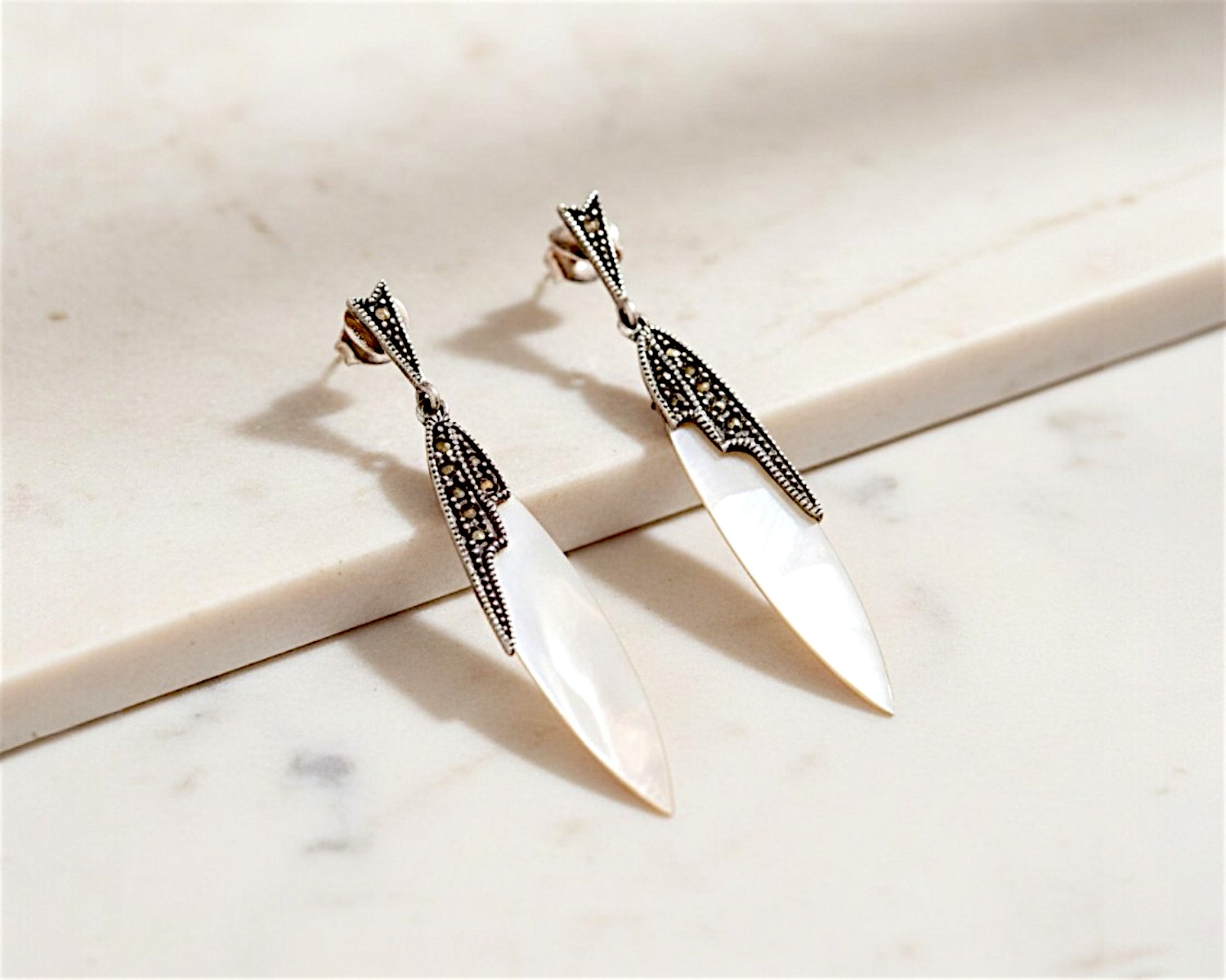 vintage style mother of pearl drop earrings for sale in Leeds set with silver and marcasite in an Art Deco style