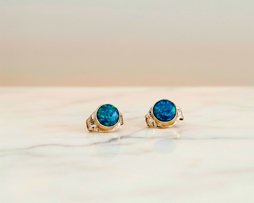 small round opal studs in dark blue for sale
