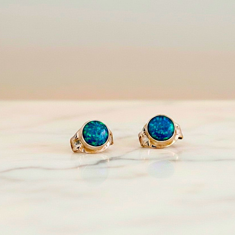 small round opal studs in dark blue for sale