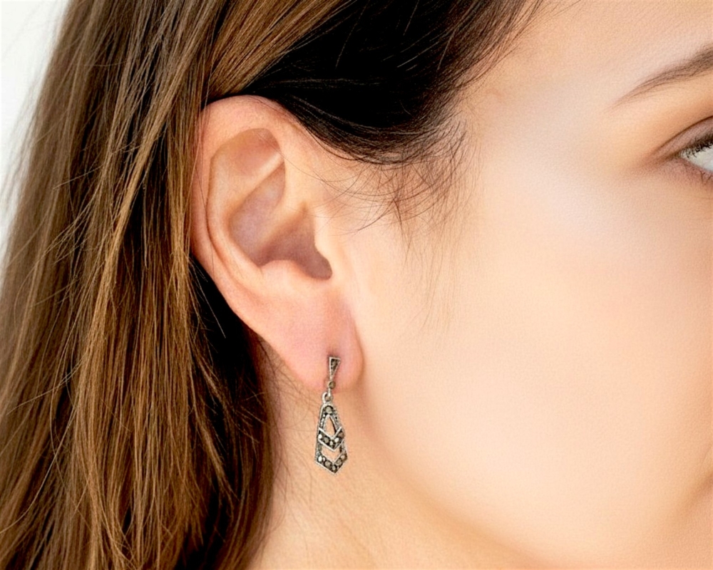 art deco style silver and marcasite small drop earrings for sale in Leeds shown in model's ear