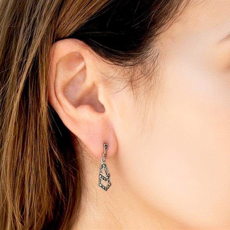 art deco style silver and marcasite small drop earrings for sale in Leeds shown in model's ear