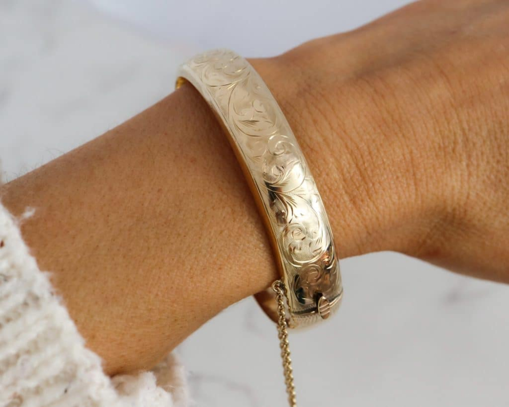 vintage 9ct gold engraved bangle dated london 1966 for sale in Leeds on lady's wrist