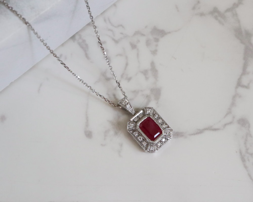 IMG_0233 art deco style ruby and diamond pendant on a 9ct white gold chain for sale in Leeds