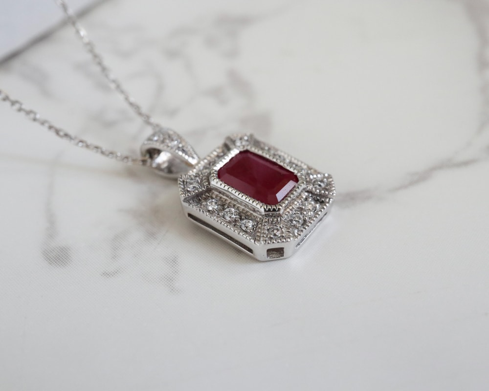 art deco style ruby and diamond pendant on a 9ct white gold chain for sale in Leeds