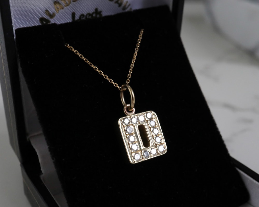 vintage 9ct gold initial pendant set with diamonds on a 16 inch chain for sale in Leeds
