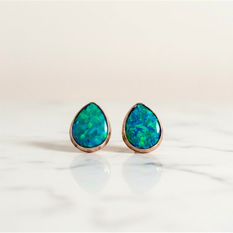 modern silver opal pear shaped stud earrings for pierced ears in dark blue/green