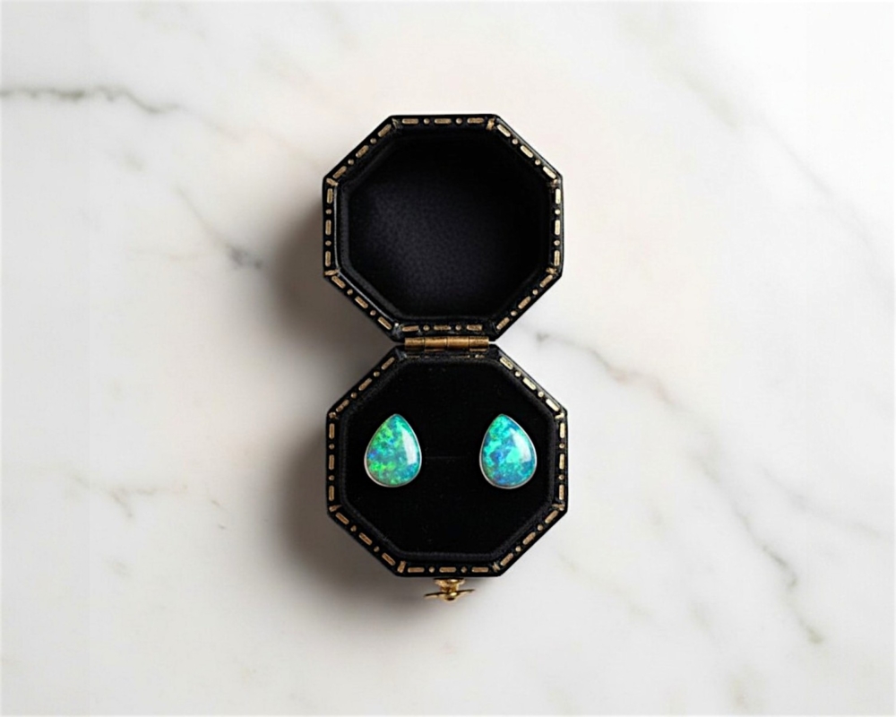 modern silver opal pear shaped stud earrings for pierced ears in dark blue/green in black presentation box