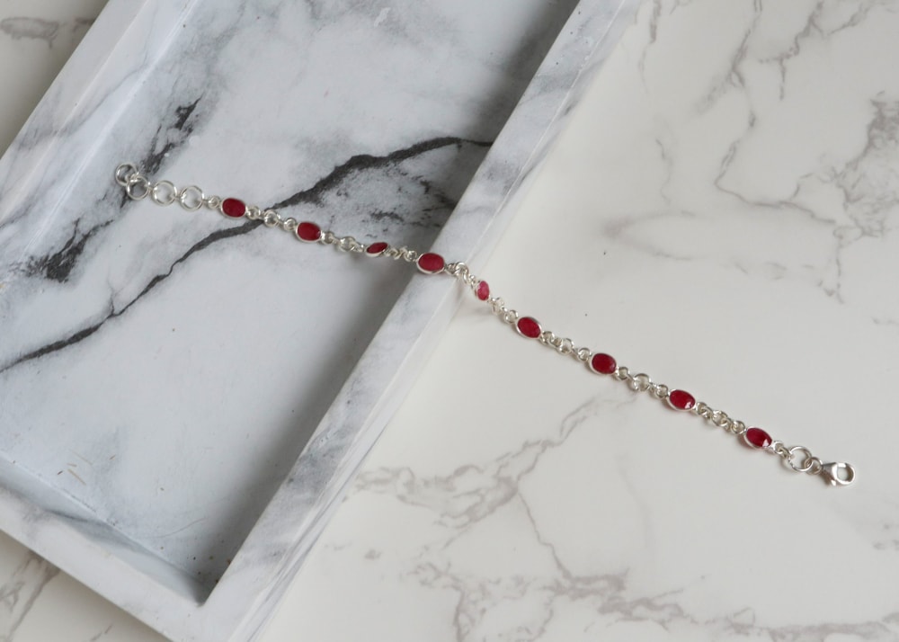 SHIPPING - UK ORDERS: Orders received before 11am Monday-Friday UK time will be dispatched the same day. This is via Royal Mail Special Delivery which is a fully tracked and insured service and will require a signature on arrival. INTERNATIONAL ORDERS: Please allow 1-2 days processing time. For orders under £350 we use Royal Mail International Tracked and Traced, with delivery around 7-10 days. For orders above £350 we use a door to door courier service with delivery between 3-7 days depending on location. You will receive a tracking number for accurate delivery information. We are not responsible for any import duty or VAT on delivery, this rate varies in different countries so please get in touch with your local customs office for more information. Our jewellery comes packaged in a beautiful black faux leather box and black branded gift bag. RETURNS: We do accept returns provided they are returned within 14 days from receiving the item. We will issue a full refund minus the shipping cost. We will provide a return address and this must be returned at the cost of the customer using a fully insured, tracked and signed for service. The item must be returned exactly as it was sent, unaltered and undamaged and in the original packaging. This must be marked clearly as a return, otherwise we reserve the right to deduct any import charges made to us from the refund on all international orders. We do not accept returns on sale items or alterations including ring sizings.