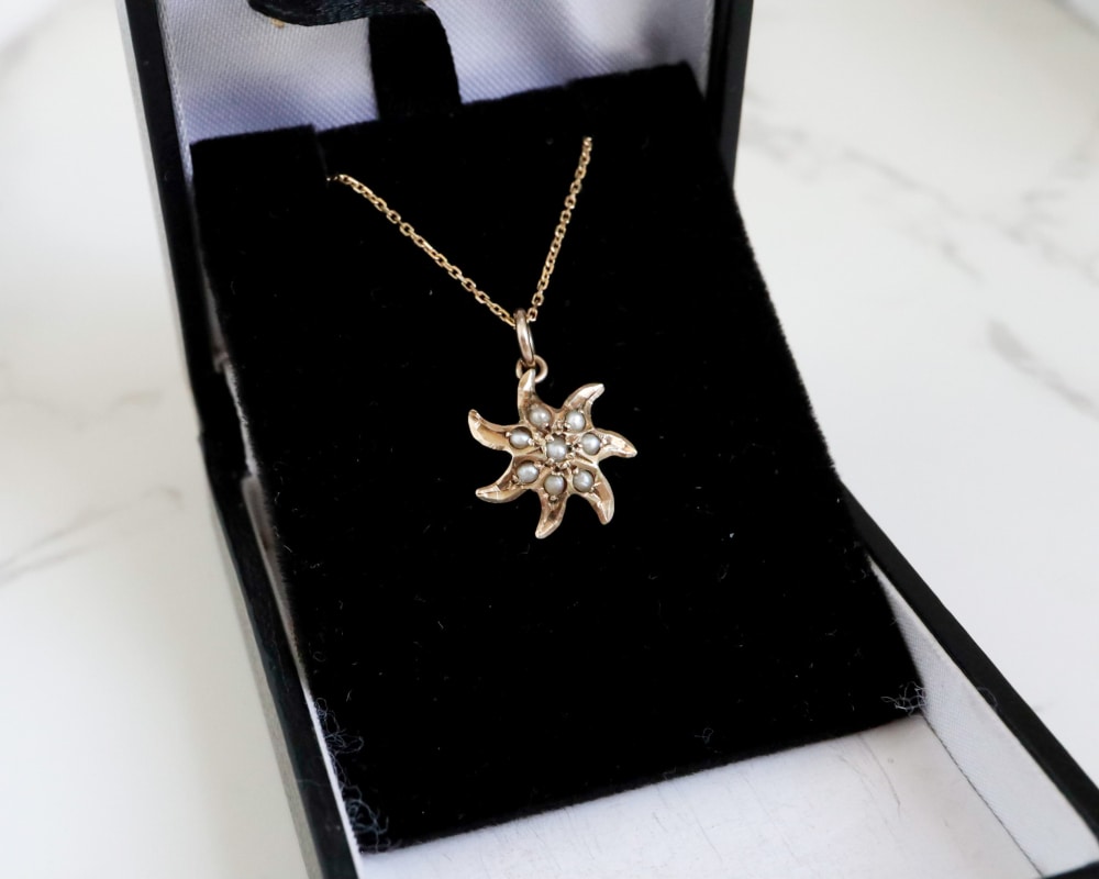 antique seed pearl pendant set in 10ct gold, originally an Edwardian stick pin on a modern 9ct gold chain