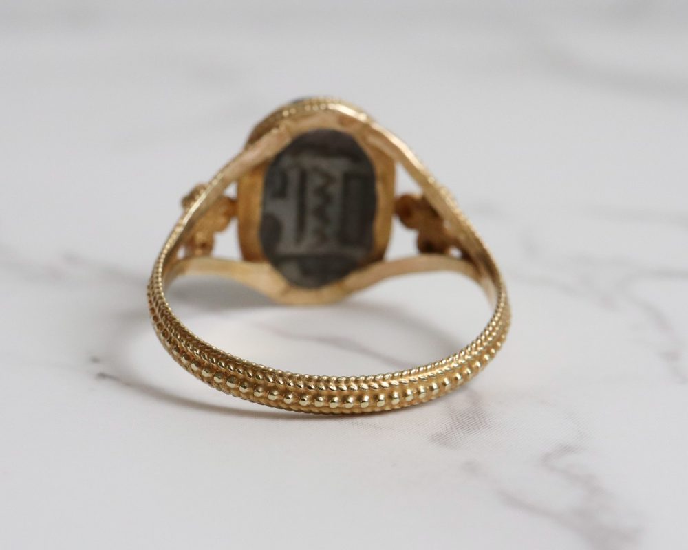 Egyptian revival scarab beetle ring set in 24ct gold.