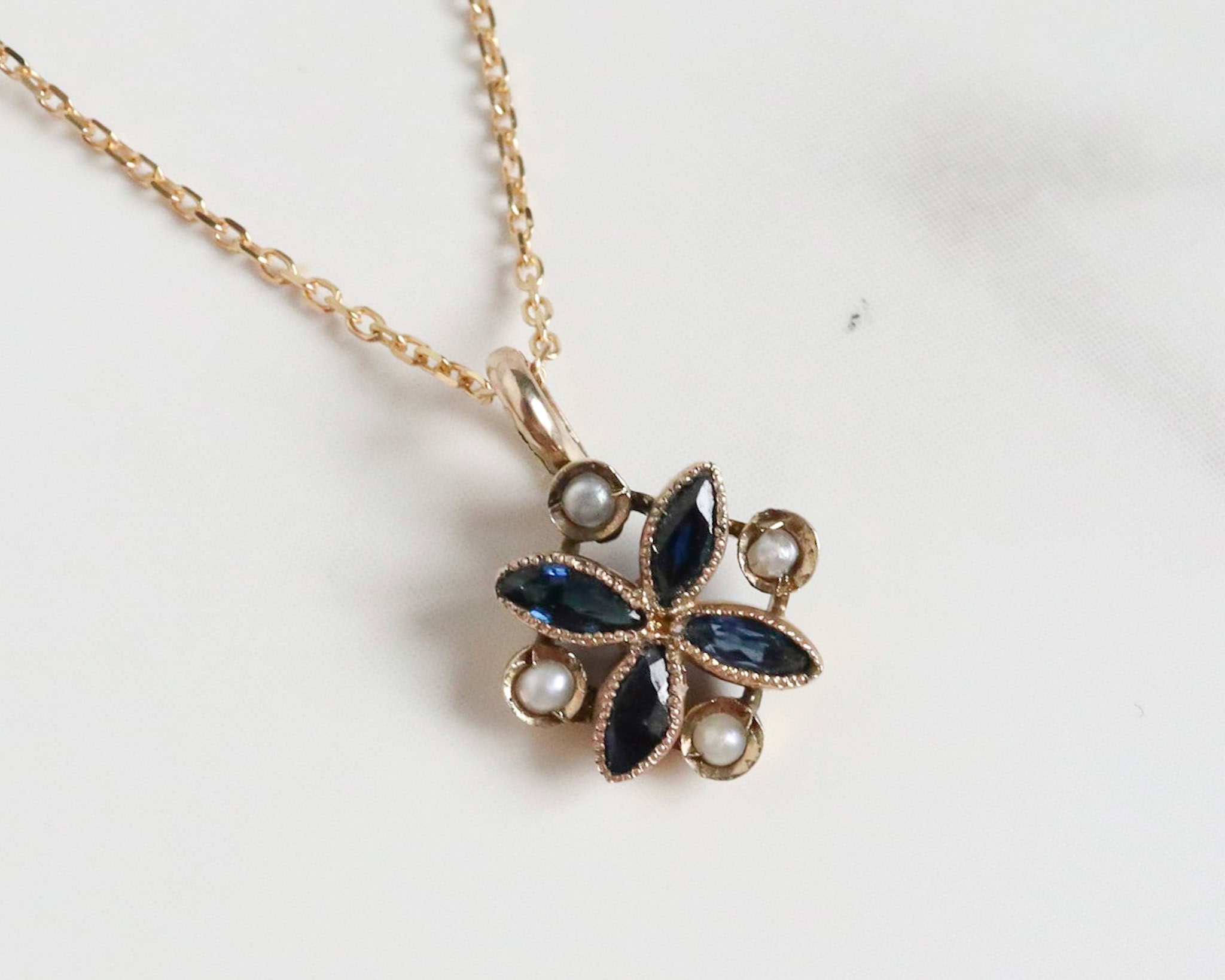 antique sapphire and seed pearl pendant from the Edwardian era. For sale in Leeds, Yorkshire