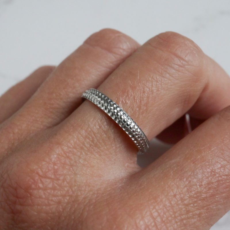 Contemporary platinum band with textured pattern