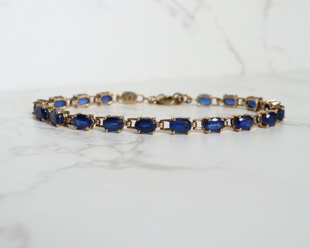 Modern sapphire tennis bracelet set in 10ct gold for sale in Leeds, Yorkshire