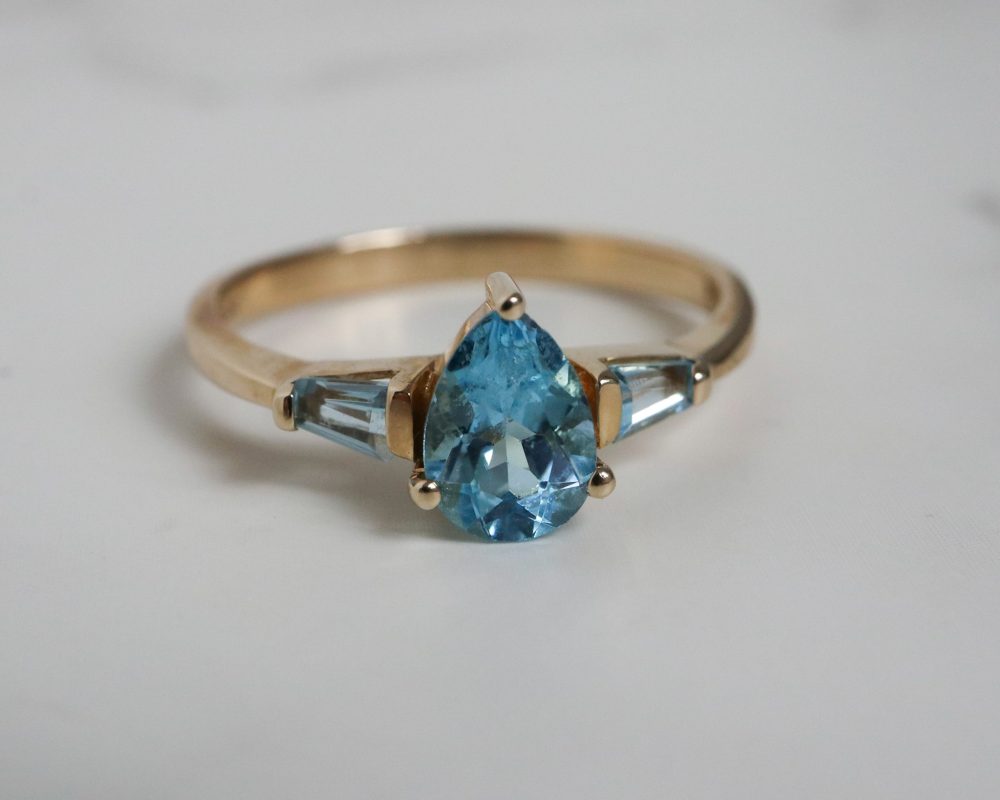 IMG_4309 Vintage blue topaz ring set in 9ct yellow gold. Pear cut and baguette cut blue topaz stones