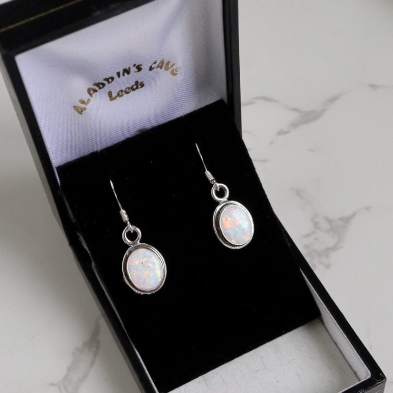 Silver and oval opal drop earrings for sale