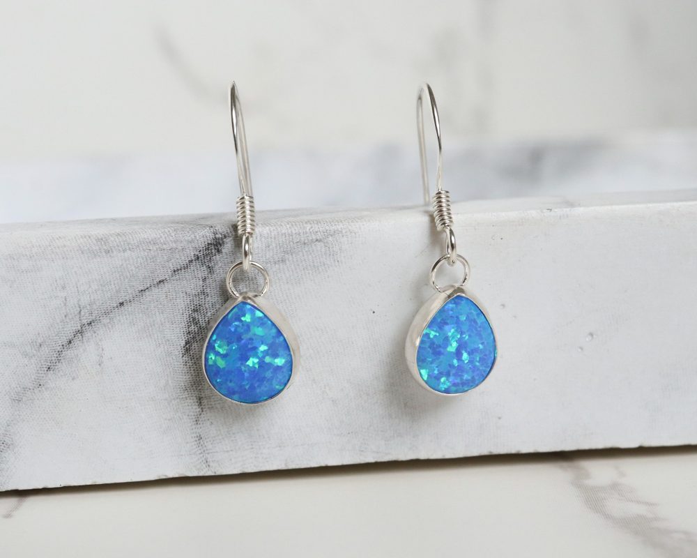 Silver and oval opal drop earrings for sale