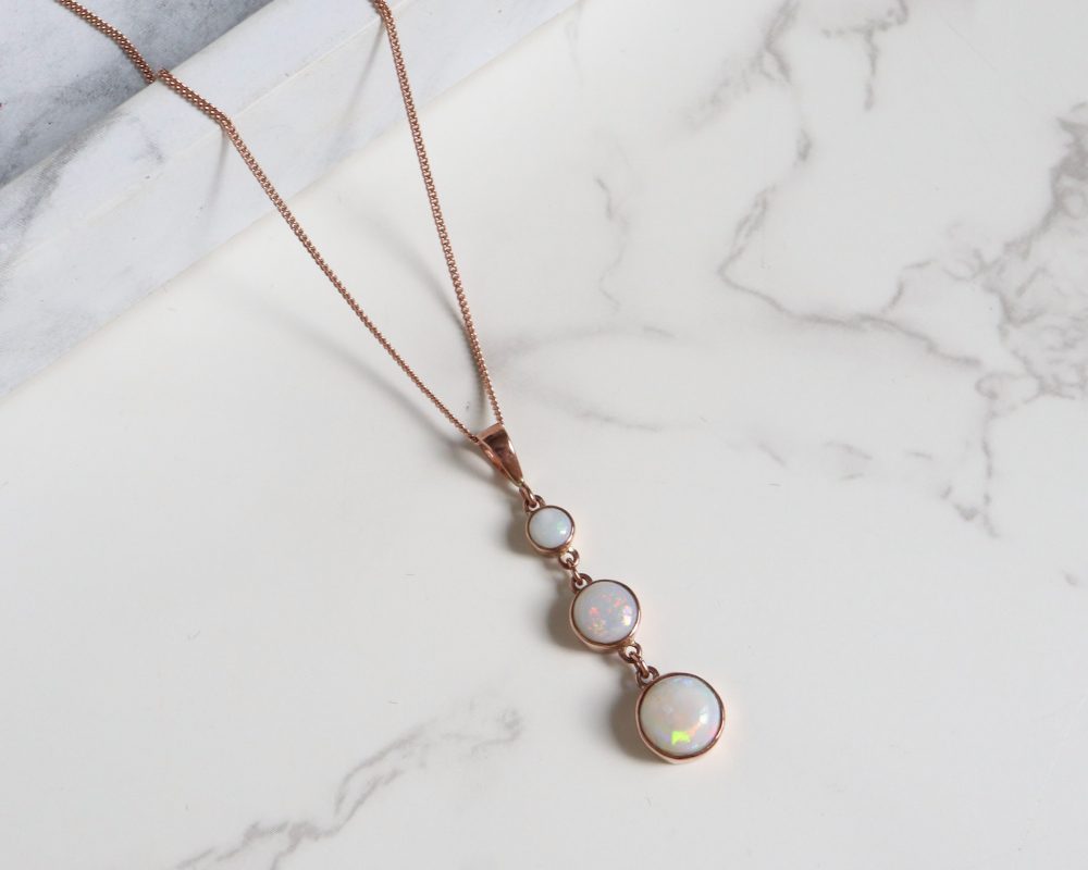 Modern 9ct rose gold opal pendant necklace on an 18 inch rose gold chain