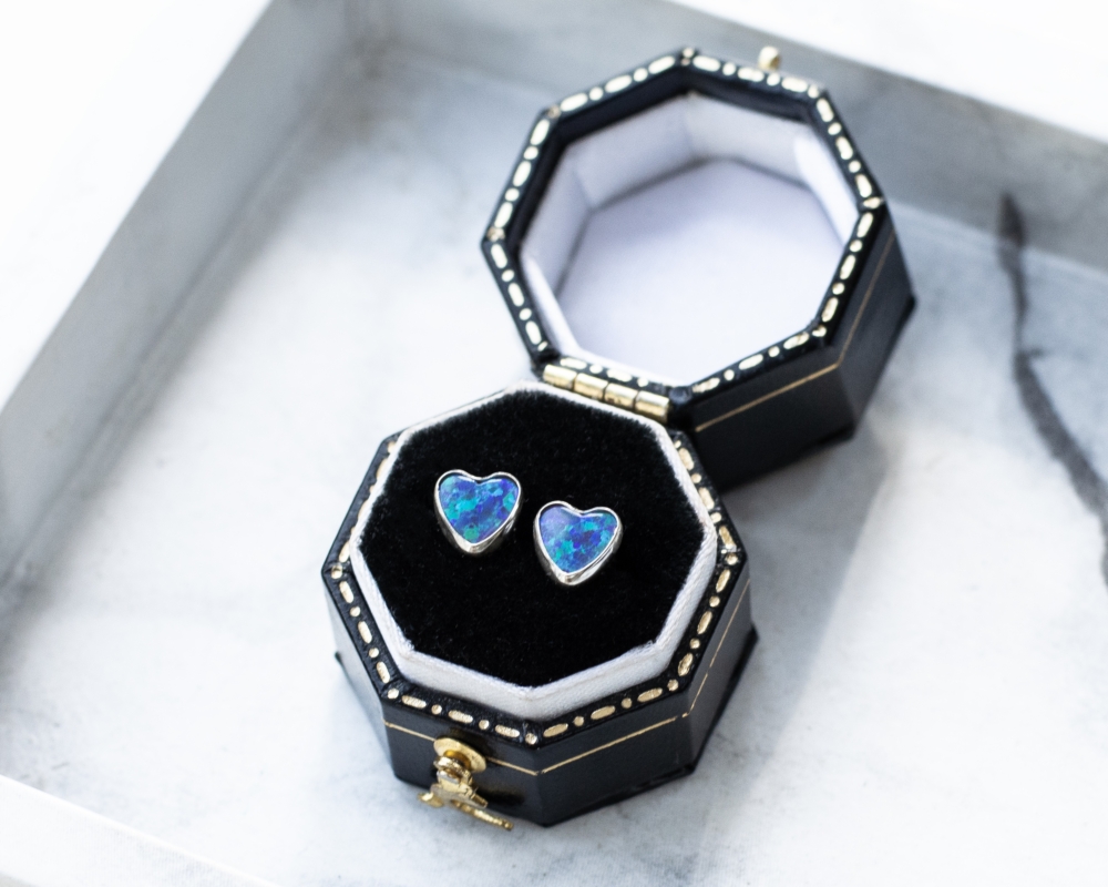 modern silver and opal heart studs for pierced ears in gift box