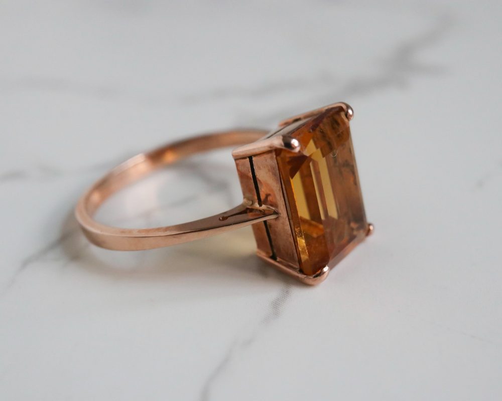 Modern 9ct rose gold citrine ring in an emerald cut stone