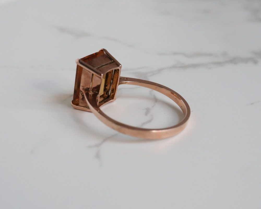 Modern 9ct rose gold citrine ring in an emerald cut stone