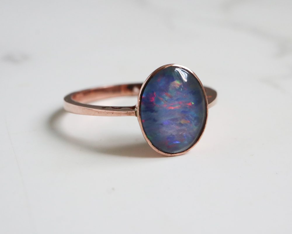 Modern opal ring set in 9ct rose gold for sale in Leeds, Yorkshire