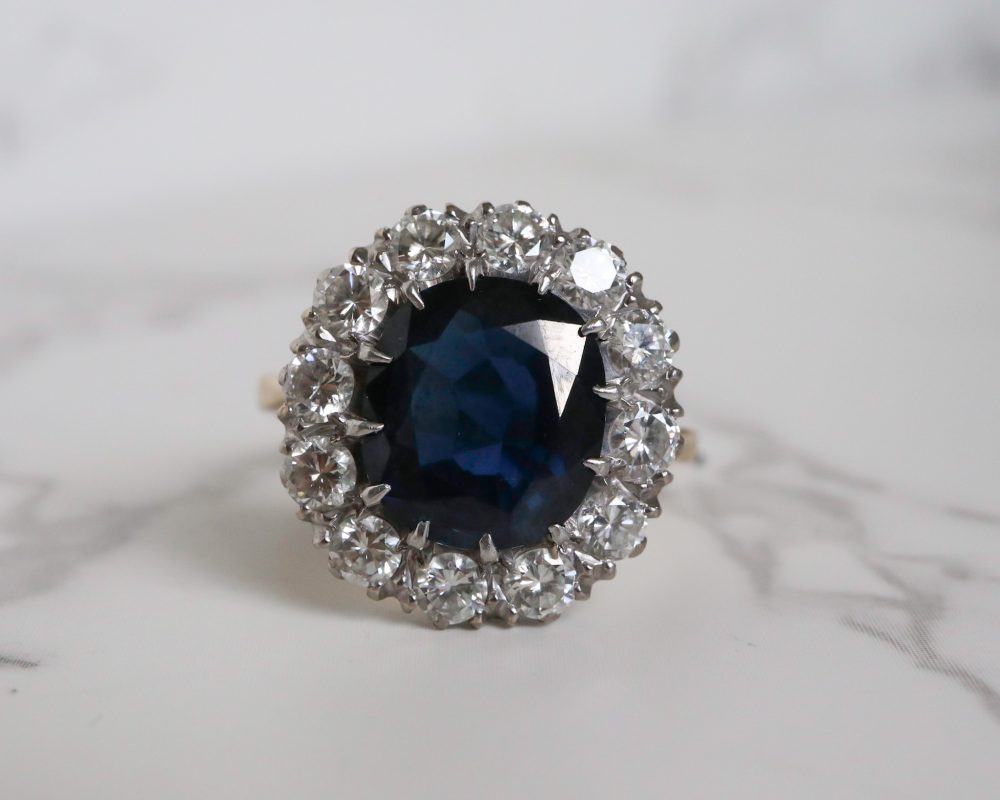 1940s sapphire and diamond cluster ring set in platinum and 18ct yellow gold for sale in Leeds, Yorkshire