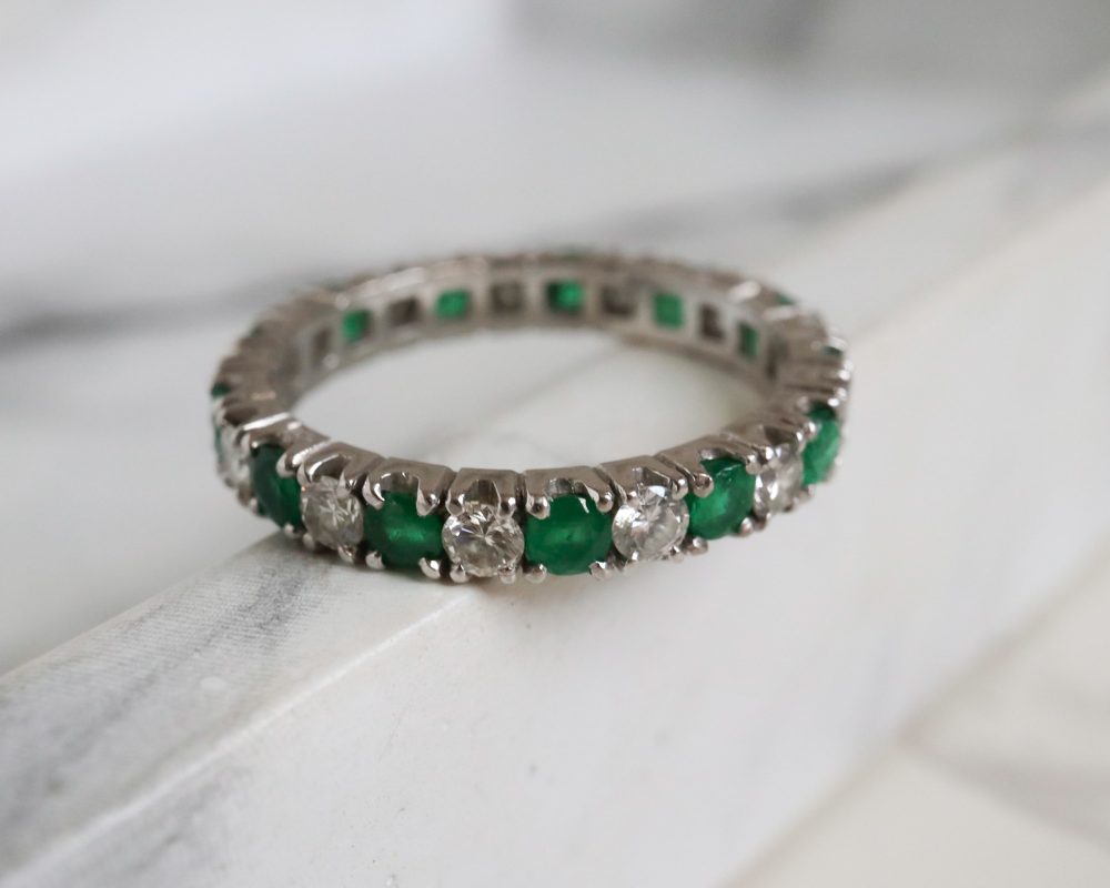Antique emerald and diamond full eternity ring circa 1930s set in 14ct white gold for sale in Leeds, Yorkshire