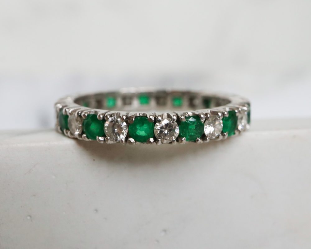 Antique emerald and diamond full eternity ring circa 1930s set in 14ct white gold for sale in Leeds, Yorkshire
