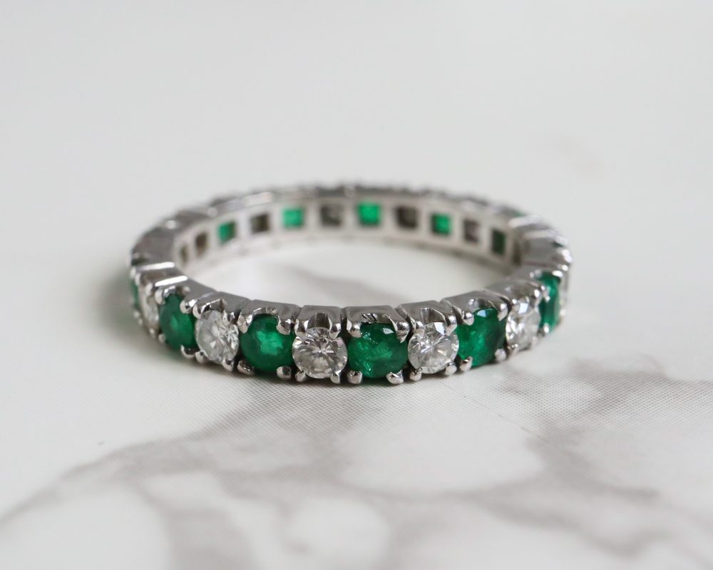 Antique emerald and diamond full eternity ring circa 1930s set in 14ct white gold for sale in Leeds, Yorkshire