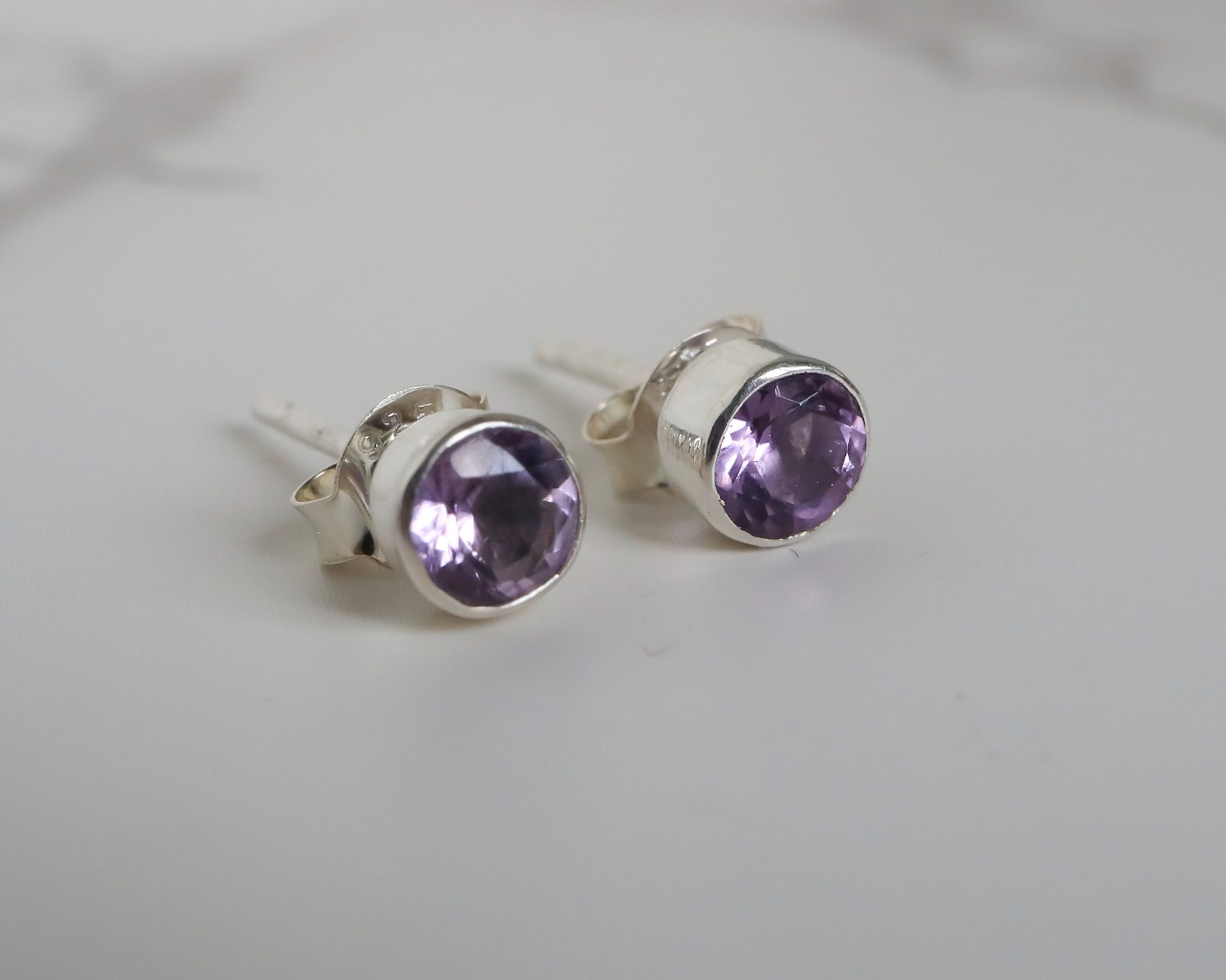 Silver and amethyst stud earrings for pierced ears