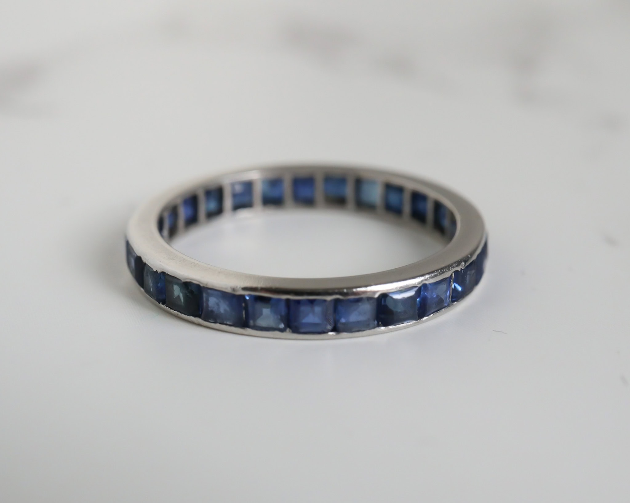 Antique Art Deco sapphire eternity ring in platinum for sale in Leeds, Yorkshire
