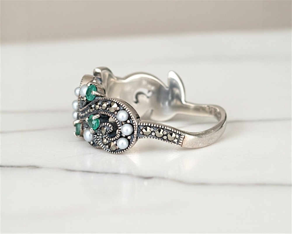 vintage style silver emerald ring with marcasite and seed pearl stones for sale in Leeds, showing side profile