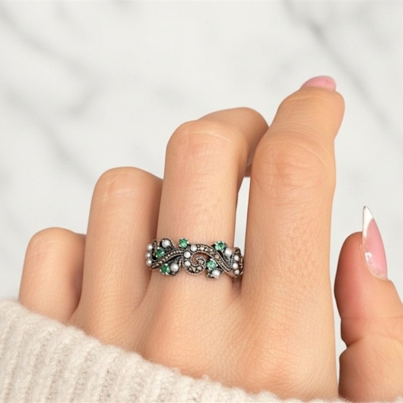 vintage style silver emerald ring on model's hand for sale in leeds