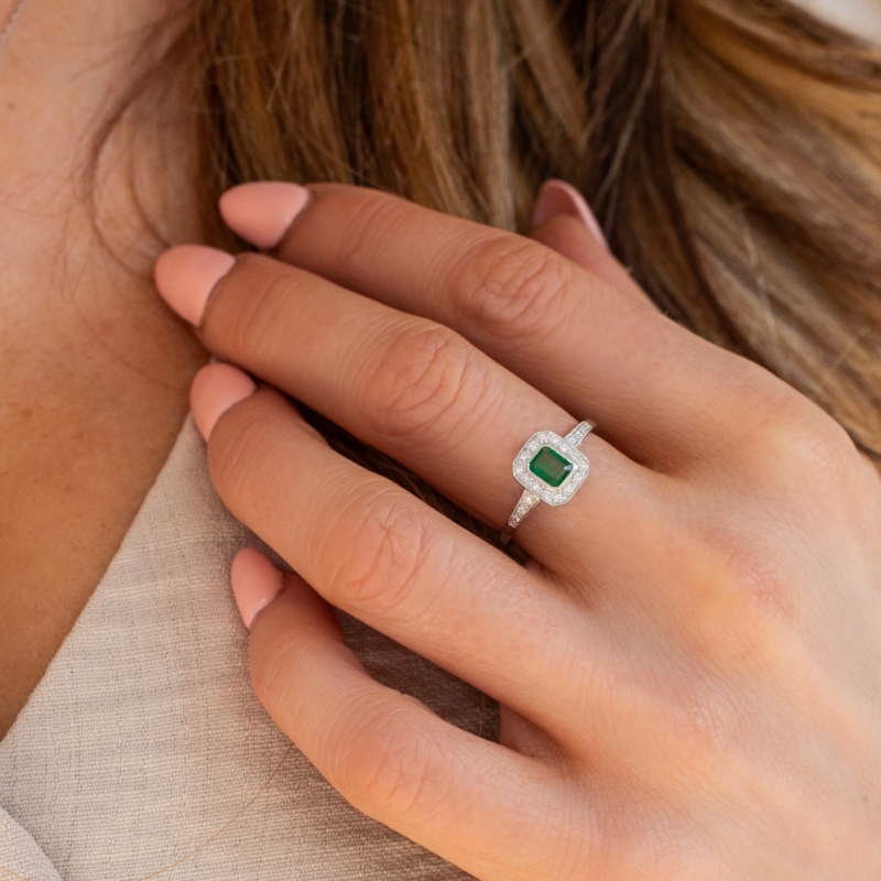 art deco style emerald and diamond ring in 9ct white gold for sale, on woman's hand