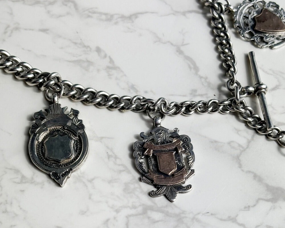 heavy antique silver albert chain with 5 medal fobs