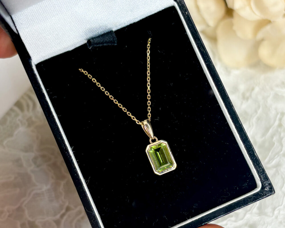 modern 9ct yellow gold and emerald cut peridot pendant on an 18 inch 9ct yellow gold chain for sale