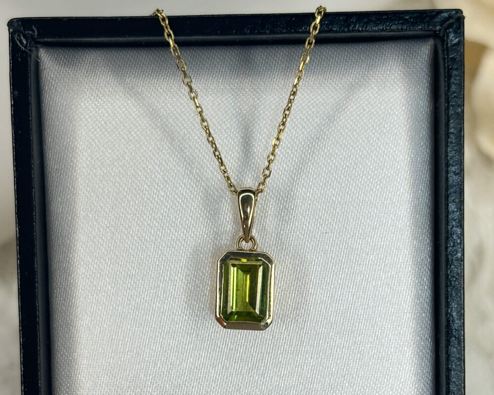 modern 9ct yellow gold and emerald cut peridot pendant on an 18 inch 9ct yellow gold chain for sale