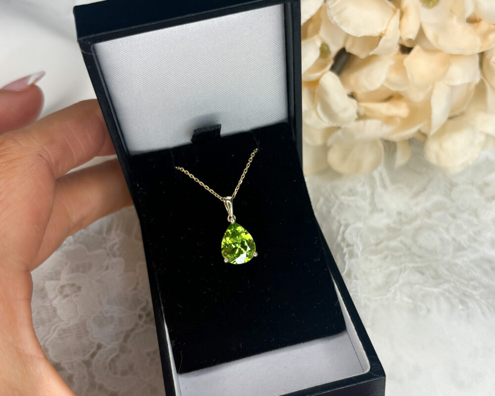 modern 9ct yellow gold and pear cut peridot pendant on an 18 inch gold chain for sale