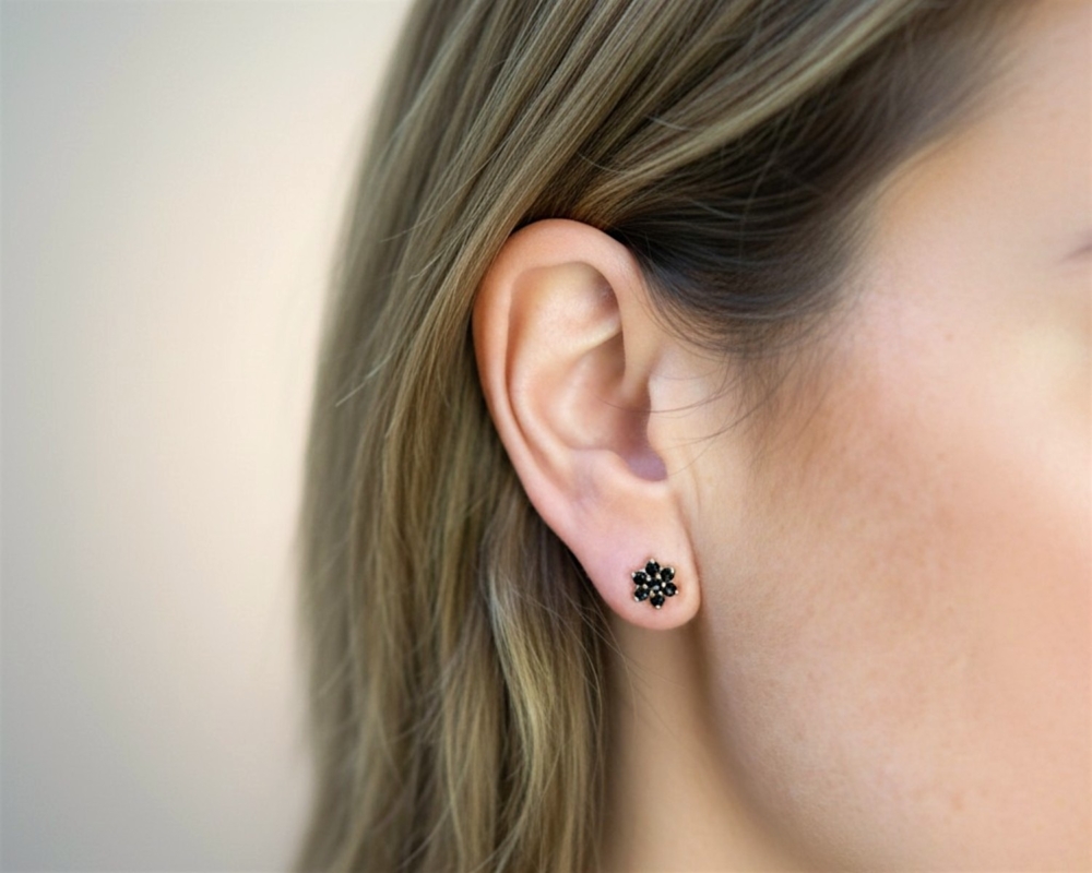 9ct gold sapphire floral cluster earrings for sale in model's ear