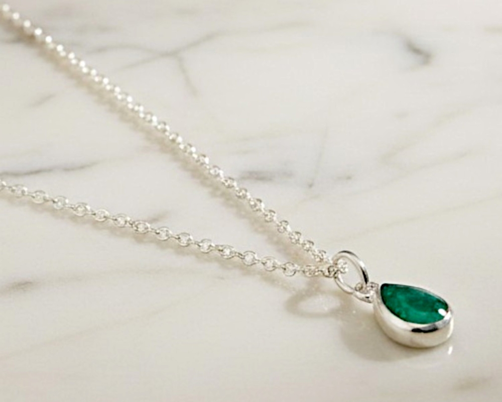silver pear cut emerald pendant on a silver chain